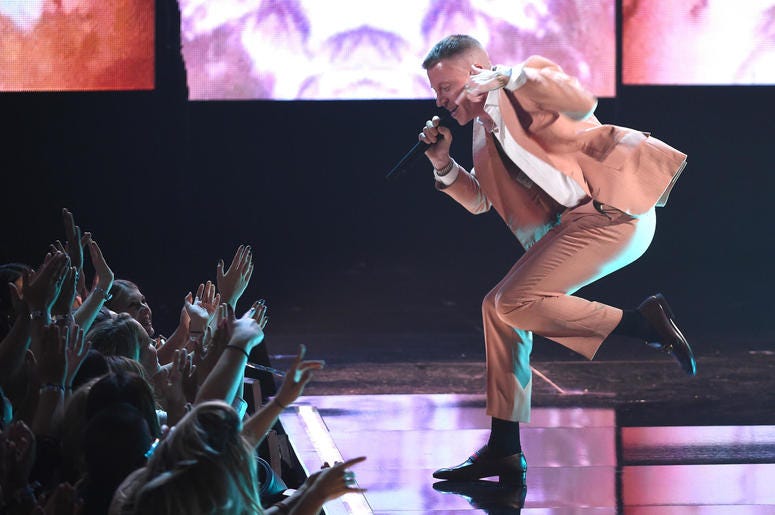 Macklemore performs at the 2017 American Music Awards Macklemore performs at the 2017 American Music Awards