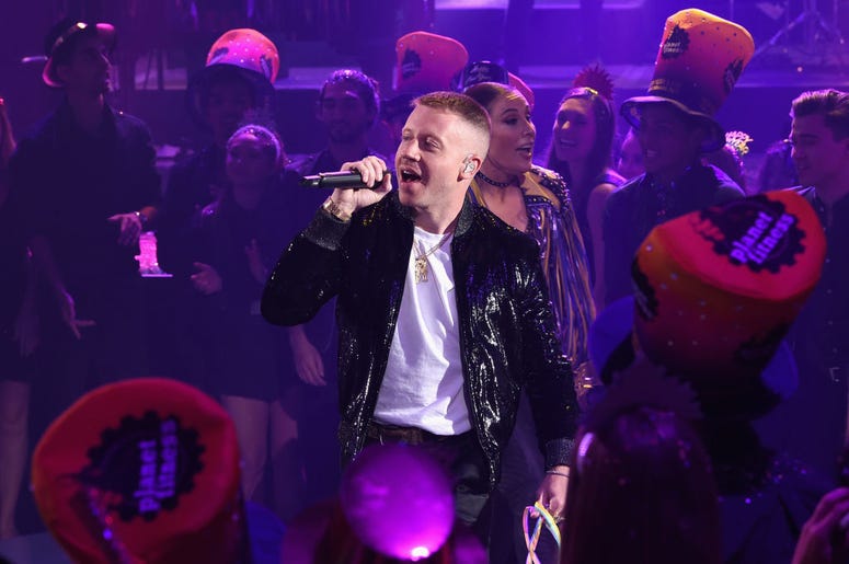 Macklemore performs onstage during Dick Clark's New Year's Rockin' Eve With Ryan Seacrest 2019 on December 31, 2018 in Los Angeles, California Macklemore performs onstage during Dick Clark's New Year's Rockin' Eve With Ryan Seacrest 2019 on December 31, 2018 in Los Angeles, California
