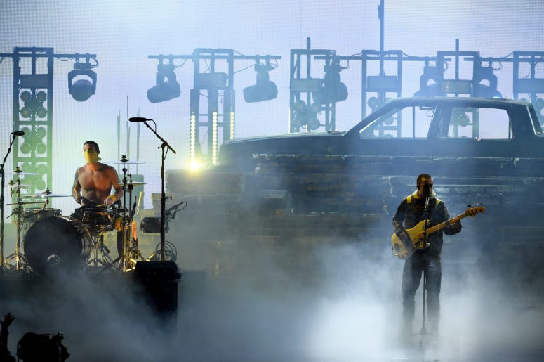 Josh Dun (L) and Tyler Joseph of Twenty One Pilots perform onstage during the 2018 American Music Awards Josh Dun (L) and Tyler Joseph of Twenty One Pilots perform onstage during the 2018 American Music Awards