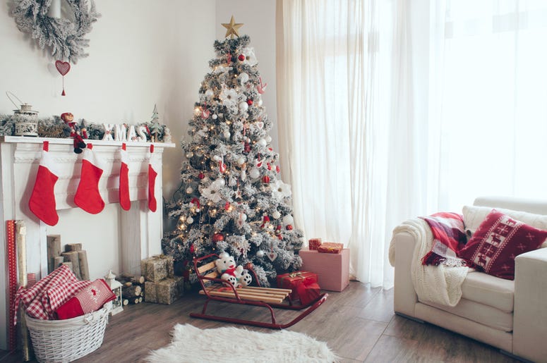 Beautiful holdiay decorated room with Christmas tree with presents under it Beautiful holdiay decorated room with Christmas tree with presents under it