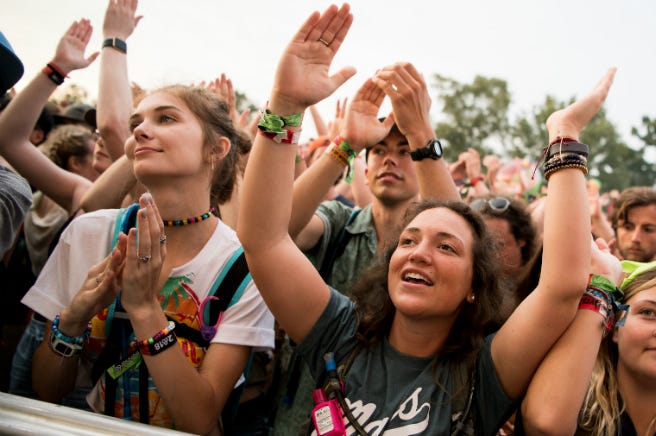 Music Festival Crowd The crowd cheers as Moon Taxi performs at the Bonnaroo Music and Arts Festival.