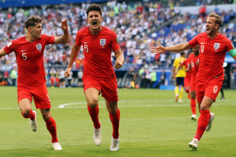 England wins over Sweden in World Cup 2018 Semi-Final July 7, 2018; Samara, Russia; England player Harry Maguire (6) celebrates with John Stones (5) and Harry Kane (9) after scoring a goal against Sweden in the quarterfinals during the FIFA World Cup 2018 at Samara Stadium.