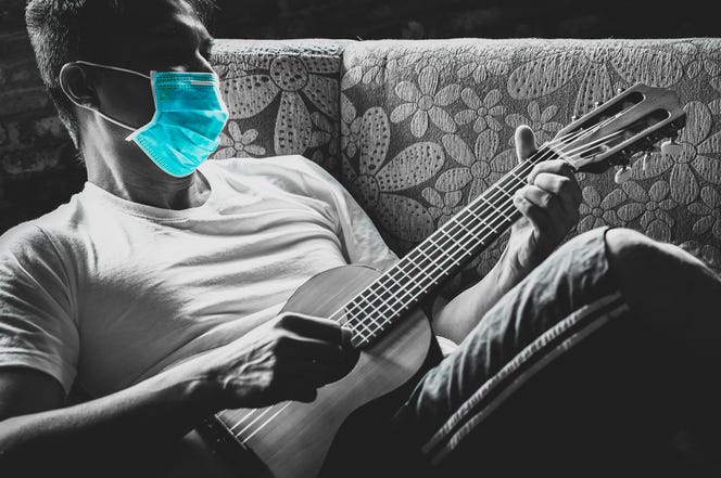 guitar player with mask