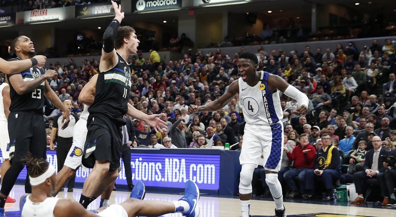 Victor Oladipo celebrates against the Bucks