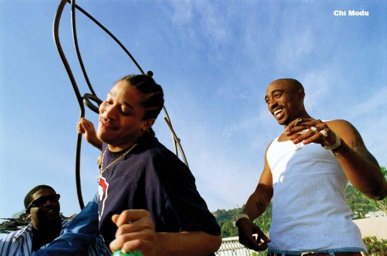 Tupac with friends in Los Angeles. (1995) Tupac laughing with his friends on the roof top of the Wyndham Belage hotel in West Hollywood, CA. December 1995(Chi Modu/diverseimages)