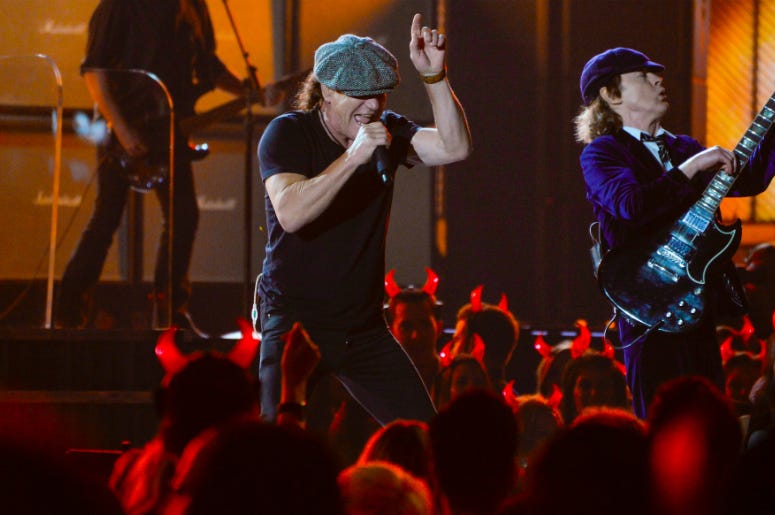 AC/DC lead vocalist Brian Johnson (left) and guitarist Angus Young performs \"Rock or Bust\" and \"Highway to Hell\" at the 57th annual Grammy Awards at the Nokia Theatre. AC/DC lead vocalist Brian Johnson (left) and guitarist Angus Young performs \"Rock or Bust\" and \"Highway to Hell\" at the 57th annual Grammy Awards at the Nokia Theatre.