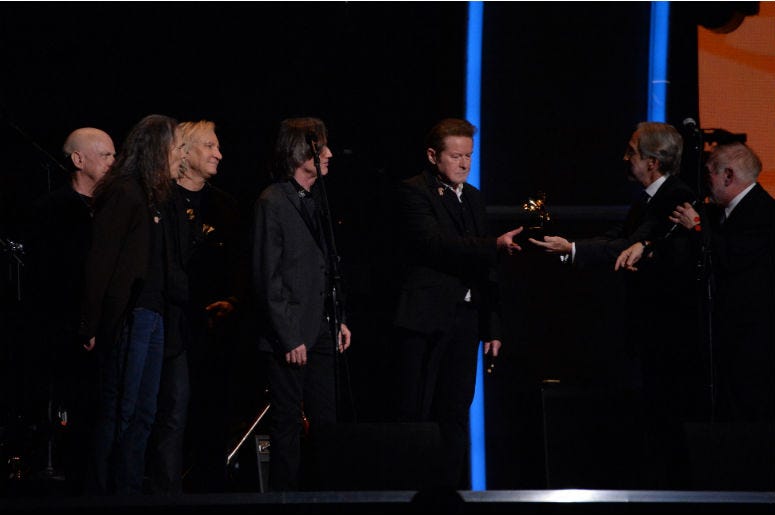 Don Henley, Joe Walsh and other members of the Eagles after a tribute to Glenn Frey was performed during the 58th Grammy Awards at the Staples Center Don Henley, Joe Walsh and other members of the Eagles after a tribute to Glenn Frey was performed during the 58th Grammy Awards at the Staples Center