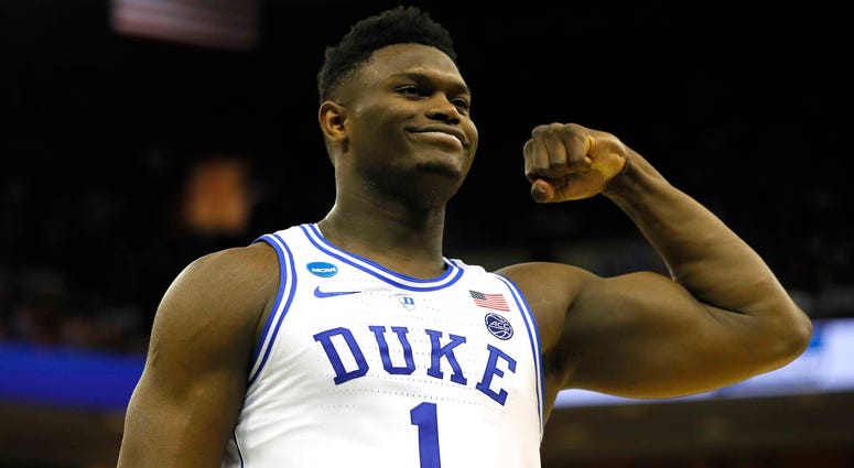 Zion Williamson lottery Zion Williamson of Duke flexes and smiles during a game against North Carolina.