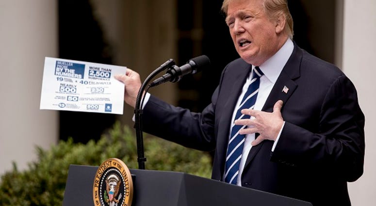 President Donald Trump holds up a stat sheet having to do with the Mueller Report as he speaks in the Rose Garden at the White House in Washington, Wednesday, May 22, 2019.(AP Photo/Andrew Harnik) President Donald Trump holds up a stat sheet having to do with the Mueller Report as he speaks in the Rose Garden at the White House in Washington, Wednesday, May 22, 2019.(AP Photo/Andrew Harnik)