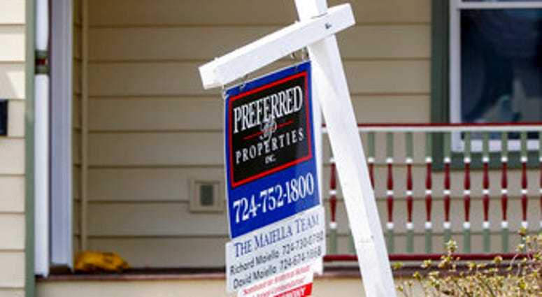 FILE This April 16, 2020 photo shows a real estate company sign marking a home for sale in Harmony, Pa. U.S. homeowners are seizing on historically low mortgage rates to refinance their mortgages. (AP Photo/Keith Srakocic) FILE This April 16, 2020 photo shows a real estate company sign marking a home for sale in Harmony, Pa. U.S. homeowners are seizing on historically low mortgage rates to refinance their mortgages. (AP Photo/Keith Srakocic)