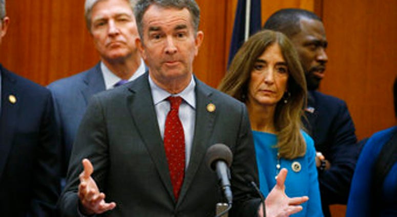 FILE - In this March 12, 2020 file photo, Virginia Gov. Ralph Northam gestures during a news conference as House speaker Eileen Filler-Corn and Secretary of Public safety Brian Moran look on at the State Capitol. (AP Photo/Steve Helber, File) FILE - In this March 12, 2020 file photo, Virginia Gov. Ralph Northam gestures during a news conference as House speaker Eileen Filler-Corn and Secretary of Public safety Brian Moran look on at the State Capitol. (AP Photo/Steve Helber, File)