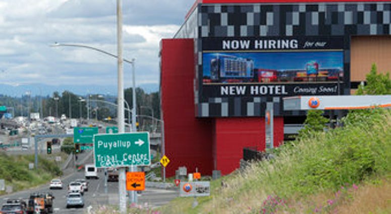 FILE - In this July 9, 2020, file photo, a large video display reads "Now hiring for our new hotel coming soon!," at the new Emerald Queen Casino, which is open, and owned by the Puyallup Tribe of Indians, in Tacoma, Wash. (AP Photo/Ted S. Warren, File) FILE - In this July 9, 2020, file photo, a large video display reads "Now hiring for our new hotel coming soon!," at the new Emerald Queen Casino, which is open, and owned by the Puyallup Tribe of Indians, in Tacoma, Wash. (AP Photo/Ted S. Warren, File)