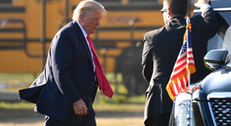President Donald Trump walks to his car after arrive in Southampton, N.Y., on Marine One, Saturday, Aug. 8, 2020. Trump is attending two fundraisers during his visit to the Hamptons. (AP Photo/Susan Walsh) President Donald Trump walks to his car after arrive in Southampton, N.Y., on Marine One, Saturday, Aug. 8, 2020. Trump is attending two fundraisers during his visit to the Hamptons. (AP Photo/Susan Walsh)