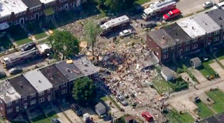 This photo provided by WJLA-TV shows the scene of an explosion in Baltimore on Monday, Aug. 10, 2020. Baltimore firefighters say an explosion has leveled several homes in the city. (WJLA-TV via AP) This photo provided by WJLA-TV shows the scene of an explosion in Baltimore on Monday, Aug. 10, 2020. Baltimore firefighters say an explosion has leveled several homes in the city. (WJLA-TV via AP)
