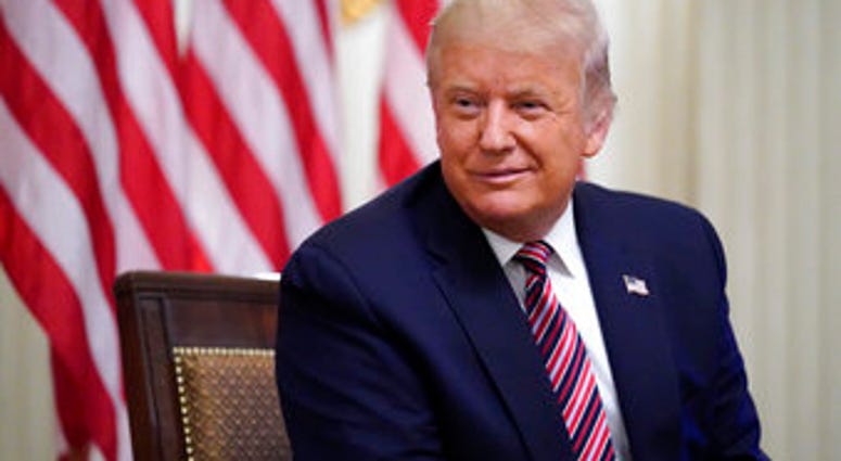 President Donald Trump listens during an event called "Kids First: Getting America's Children Safely Back to School" in the State Dining room of the White House, Wednesday, Aug. 12, 2020, in Washington. (AP Photo/Andrew Harnik) President Donald Trump listens during an event called "Kids First: Getting America's Children Safely Back to School" in the State Dining room of the White House, Wednesday, Aug. 12, 2020, in Washington. (AP Photo/Andrew Harnik)
