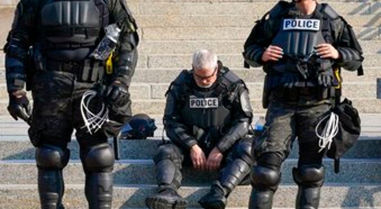 Police in riot gear stand outside the Kenosha County Court House Monday, Aug. 24, 2020, in Kenosha, Wis. Protests broke out late Sunday night after a police shooting. (AP Photo/Morry Gash) Police in riot gear stand outside the Kenosha County Court House Monday, Aug. 24, 2020, in Kenosha, Wis. Protests broke out late Sunday night after a police shooting. (AP Photo/Morry Gash)