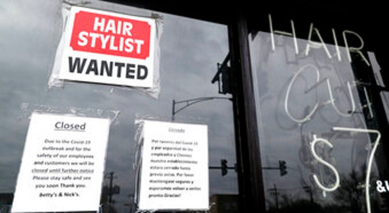FILE - In this April 30 ,2020 file photo, a barber shop shows closed and hiring sign during the COVID-19 in Chicago. (AP Photo/Nam Y. Huh, File) FILE - In this April 30 ,2020 file photo, a barber shop shows closed and hiring sign during the COVID-19 in Chicago. (AP Photo/Nam Y. Huh, File)