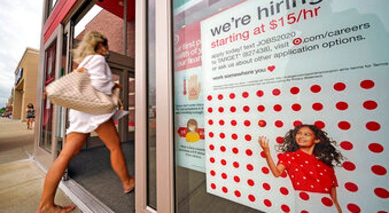 FILE - In this Sept. 2, 2020, file photo, a help wanted sign hangs on the door of a Target store in Uniontown, Pa. (AP Photo/Gene J. Puskar, File) FILE - In this Sept. 2, 2020, file photo, a help wanted sign hangs on the door of a Target store in Uniontown, Pa. (AP Photo/Gene J. Puskar, File)