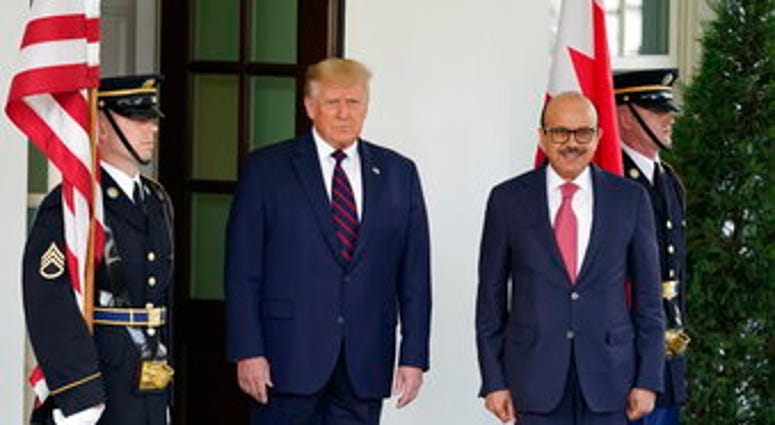President Donald Trump greets the Bahrain Foreign Minister Khalid bin Ahmed Al Khalifa at the White House, Tuesday, Sept. 15, 2020, in Washington. (AP Photo/Alex Brandon) President Donald Trump greets the Bahrain Foreign Minister Khalid bin Ahmed Al Khalifa at the White House, Tuesday, Sept. 15, 2020, in Washington. (AP Photo/Alex Brandon)