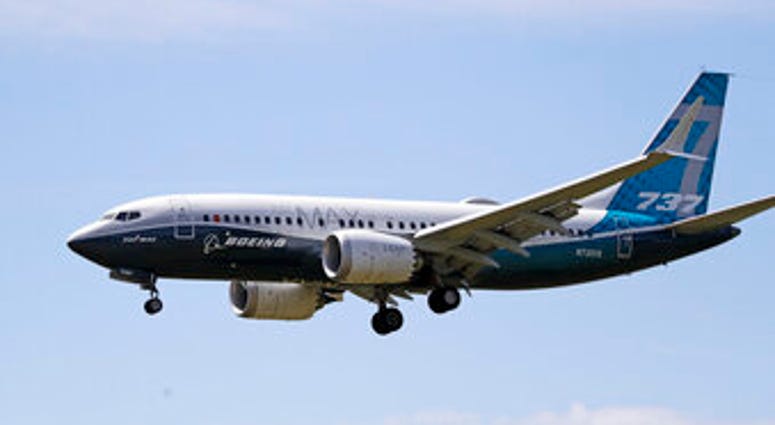 FILE - In this Monday, June 29, 2020, file photo, a Boeing 737 Max jet heads to a landing at Boeing Field following a test flight in Seattle. (AP Photo/Elaine Thompson, File) FILE - In this Monday, June 29, 2020, file photo, a Boeing 737 Max jet heads to a landing at Boeing Field following a test flight in Seattle. (AP Photo/Elaine Thompson, File)