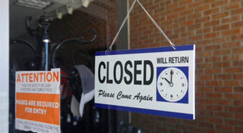 FILE - In this July 18, 2020 file photo a closed sign hangs in the window of a barber shop in Burbank, Calif. (AP Photo/Marcio Jose Sanchez, File) FILE - In this July 18, 2020 file photo a closed sign hangs in the window of a barber shop in Burbank, Calif. (AP Photo/Marcio Jose Sanchez, File)