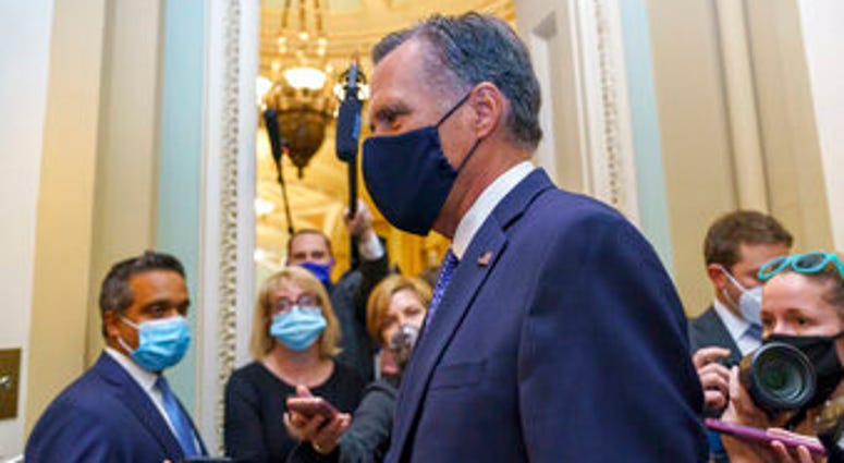 Sen. Mitt Romney, R-Utah, leaves the Senate Chamber following a vote, at the Capitol in Washington, Monday, Sept. 21, 2020. (AP Photo/J. Scott Applewhite) Sen. Mitt Romney, R-Utah, leaves the Senate Chamber following a vote, at the Capitol in Washington, Monday, Sept. 21, 2020. (AP Photo/J. Scott Applewhite)