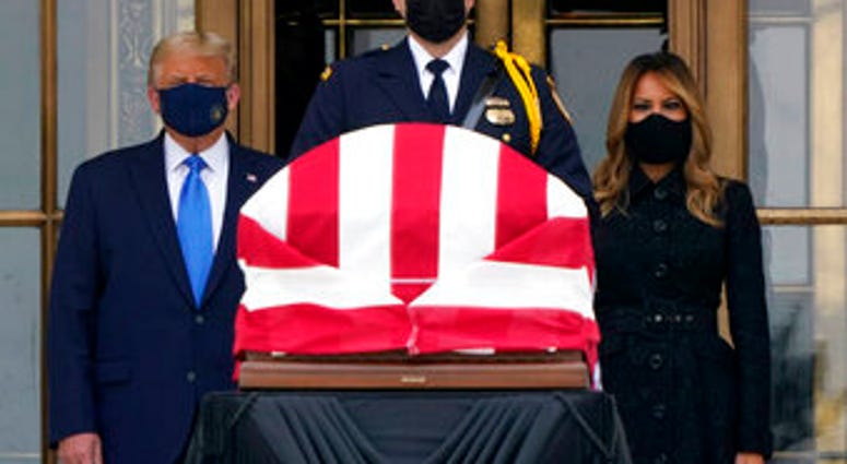 President Donald Trump and first lady Melania Trump pay respects as Justice Ruth Bader Ginsburg lies in repose at the Supreme Court building on Thursday, Sept. 24, 2020, in Washington. Ginsburg, 87, died of cancer. (AP Photo/J. Scott Applewhite) President Donald Trump and first lady Melania Trump pay respects as Justice Ruth Bader Ginsburg lies in repose at the Supreme Court building on Thursday, Sept. 24, 2020, in Washington. Ginsburg, 87, died of cancer. (AP Photo/J. Scott Applewhite)