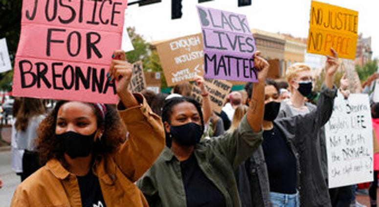 University of Georiga students lead a Black Lives Matter protest in downtown in memory of Breonna Taylor in Athens, Ga., Friday, Sept. 25, 2020. (Joshua L. Jones/Athens Banner-Herald via AP) University of Georiga students lead a Black Lives Matter protest in downtown in memory of Breonna Taylor in Athens, Ga., Friday, Sept. 25, 2020. (Joshua L. Jones/Athens Banner-Herald via AP)