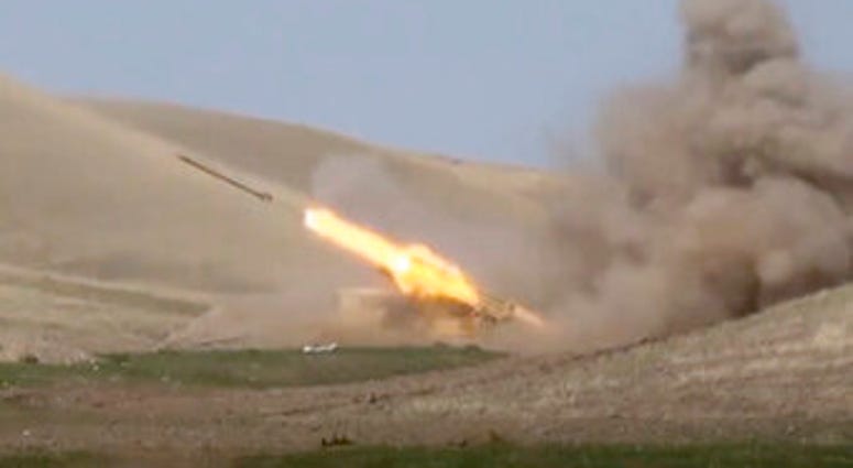 In this image taken from footage released by Azerbaijan's Defense Ministry on Sunday, an Azerbaijan's rocket launches from missile system at the contact line of the self-proclaimed Republic of Nagorno-Karabakh. (Azerbaijan's Defense Ministry via AP) In this image taken from footage released by Azerbaijan's Defense Ministry on Sunday, an Azerbaijan's rocket launches from missile system at the contact line of the self-proclaimed Republic of Nagorno-Karabakh. (Azerbaijan's Defense Ministry via AP)