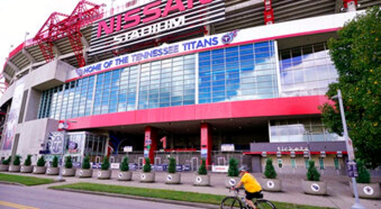 A cyclist passes by Nissan Stadium, home of the Tennessee Titans, Tuesday, Sept. 29, 2020, in Nashville, Tenn. (AP Photo/Mark Humphrey) A cyclist passes by Nissan Stadium, home of the Tennessee Titans, Tuesday, Sept. 29, 2020, in Nashville, Tenn. (AP Photo/Mark Humphrey)