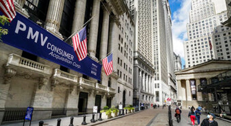 FILE - Pedestrians pass the New York Stock Exchange, Friday, Oct. 2, 2020, in New York. Stocks are opening broadly higher on Wall Street, following global markets higher on Election Day in the U.S. (AP Photo/John Minchillo) FILE - Pedestrians pass the New York Stock Exchange, Friday, Oct. 2, 2020, in New York. Stocks are opening broadly higher on Wall Street, following global markets higher on Election Day in the U.S. (AP Photo/John Minchillo)