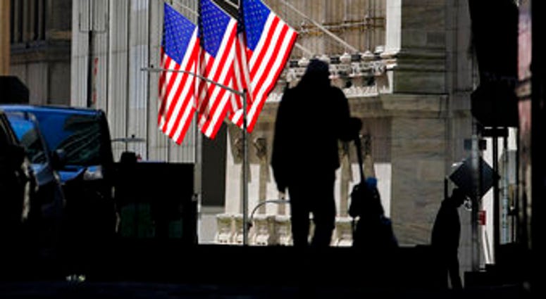 FILE - In this Oct. 14, 2020 file photo, pedestrians pass the New York Stock Exchange in New York. Stocks are ticking higher Wednesday, Nov. 11, and this time big technology stocks are rising too on Wall Street. (AP Photo/Frank Franklin II, File) FILE - In this Oct. 14, 2020 file photo, pedestrians pass the New York Stock Exchange in New York. Stocks are ticking higher Wednesday, Nov. 11, and this time big technology stocks are rising too on Wall Street. (AP Photo/Frank Franklin II, File)