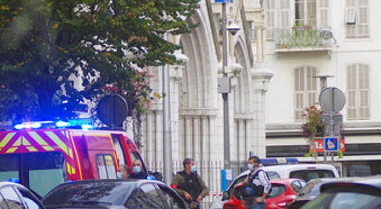 French policemen stand next to Notre Dame church after a knife attack, in Nice, France, Thursday, Oct. 29, 2020. (AP Photo/Alexis Gilli) French policemen stand next to Notre Dame church after a knife attack, in Nice, France, Thursday, Oct. 29, 2020. (AP Photo/Alexis Gilli)