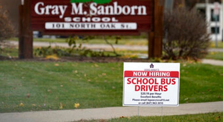 A hiring sign shows outside of Gray M. Sanborn Elementary School in Palatine, Ill., Thursday, Nov. 5, 2020. (AP Photo/Nam Y. Huh) A hiring sign shows outside of Gray M. Sanborn Elementary School in Palatine, Ill., Thursday, Nov. 5, 2020. (AP Photo/Nam Y. Huh)