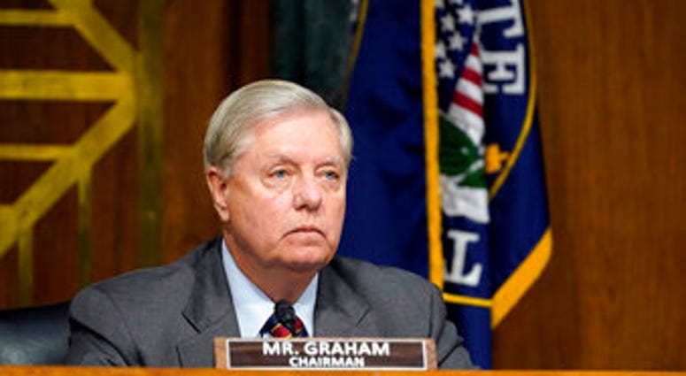 Sen. Lindsey Graham, R-S.C., arrives for a Senate Judiciary Committee hearing on Capitol Hill in Washington, Tuesday, Nov. 10, 2020, on a probe of the FBI's Russia investigation. (AP Photo/Susan Walsh, Pool) Sen. Lindsey Graham, R-S.C., arrives for a Senate Judiciary Committee hearing on Capitol Hill in Washington, Tuesday, Nov. 10, 2020, on a probe of the FBI's Russia investigation. (AP Photo/Susan Walsh, Pool)