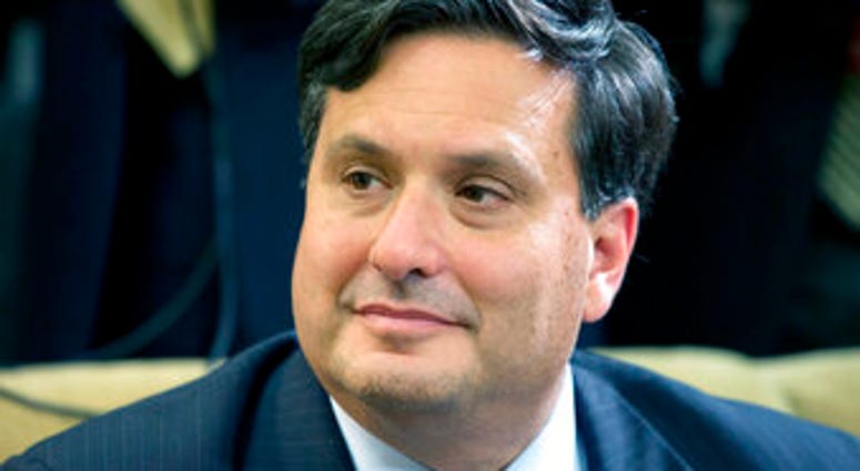 FILE - In this Wednesday, Oct. 22, 2014 file photo, Ebola coordinator Ron Klain listens as President Barack Obama speaks to the media about the government's Ebola response in the Oval Office of the White House. (AP Photo/Jacquelyn Martin, File) FILE - In this Wednesday, Oct. 22, 2014 file photo, Ebola coordinator Ron Klain listens as President Barack Obama speaks to the media about the government's Ebola response in the Oval Office of the White House. (AP Photo/Jacquelyn Martin, File)