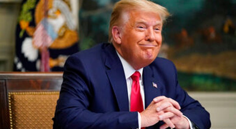 President Donald Trump participates in a video teleconference call with members of the military on Thanksgiving, Thursday, Nov. 26, 2020, at the White House in Washington. (AP Photo/Patrick Semansky) President Donald Trump participates in a video teleconference call with members of the military on Thanksgiving, Thursday, Nov. 26, 2020, at the White House in Washington. (AP Photo/Patrick Semansky)