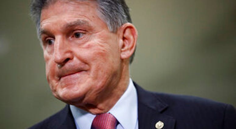 FILE - In this Feb. 5, 2020, file photo, Sen. Joe Manchin, D-W.Va., speaks with reporters on Capitol Hill in Washington. (AP Photo/Patrick Semansky, File) FILE - In this Feb. 5, 2020, file photo, Sen. Joe Manchin, D-W.Va., speaks with reporters on Capitol Hill in Washington. (AP Photo/Patrick Semansky, File)