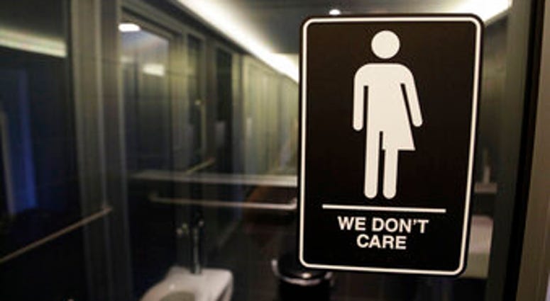 FILE - In this May 12, 2016, file photo, gender free sign hangs outside a restroom at 21c Museum Hotel in Durham, N.C. (AP Photo/Gerry Broome, File) FILE - In this May 12, 2016, file photo, gender free sign hangs outside a restroom at 21c Museum Hotel in Durham, N.C. (AP Photo/Gerry Broome, File)