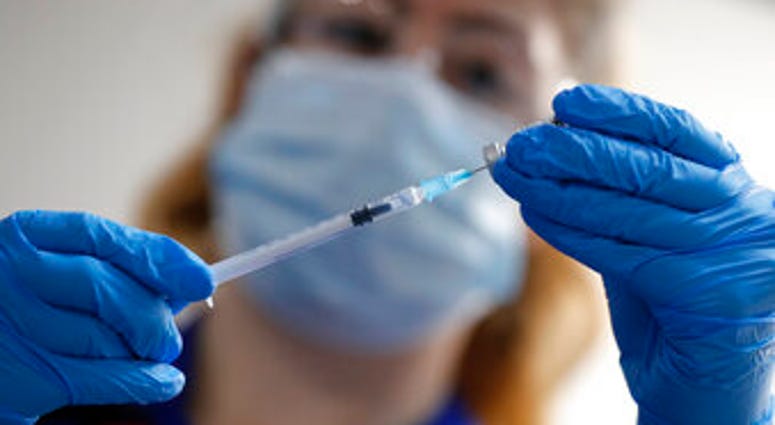 A nurse prepares a shot of the Pfizer-BioNTech COVID-19 vaccine at Guy's Hospital in London, Tuesday, Dec. 8, 2020, as the U.K. health authorities rolled out a national mass vaccination program. (AP Photo/Frank Augstein, Pool) A nurse prepares a shot of the Pfizer-BioNTech COVID-19 vaccine at Guy's Hospital in London, Tuesday, Dec. 8, 2020, as the U.K. health authorities rolled out a national mass vaccination program. (AP Photo/Frank Augstein, Pool)