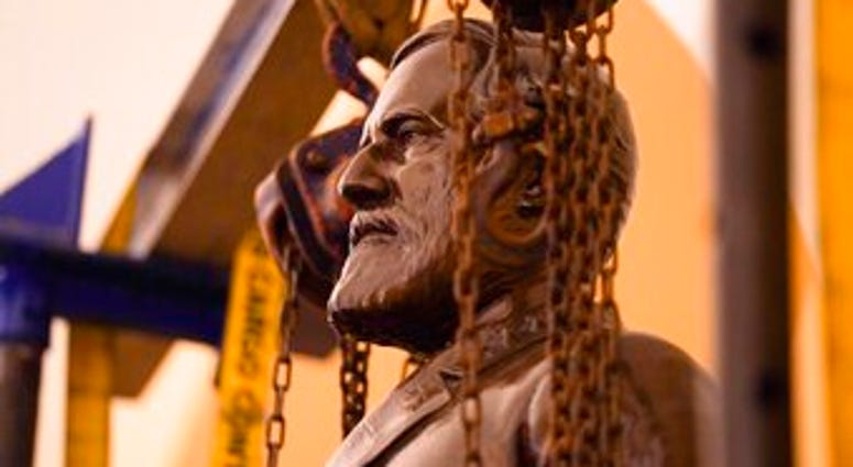 This Monday, Dec. 21, 2020 photo provided by the Office of the Governor of Virginia shows a statue of Confederate Gen. Robert E. Lee being removed from the National Statuary Hall Collection in Washington. (Jack Mayer/Office of Governor of Virginia, File) This Monday, Dec. 21, 2020 photo provided by the Office of the Governor of Virginia shows a statue of Confederate Gen. Robert E. Lee being removed from the National Statuary Hall Collection in Washington. (Jack Mayer/Office of Governor of Virginia, File)
