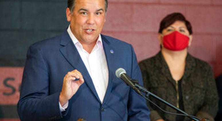 FILE - In this Tuesday, July 28, 2020 file photo, Columbus Mayor Andrew Ginther makes remarks. (Adam Cairns/The Columbus Dispatch via AP, File) FILE - In this Tuesday, July 28, 2020 file photo, Columbus Mayor Andrew Ginther makes remarks. (Adam Cairns/The Columbus Dispatch via AP, File)