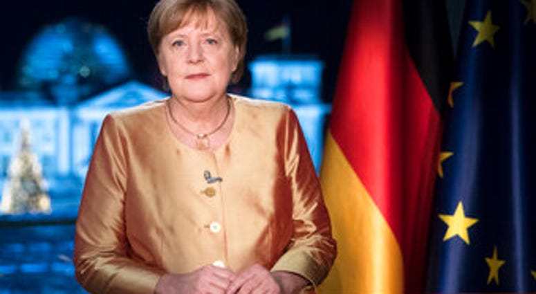 FILE - In this Dec. 30, 2020 file photo German Chancellor Angela Merkel poses for photographs after the television recording of her annual New Year's speech at the chancellery in Berlin, Germany. (AP Photo/Markus Schreiber, File) FILE - In this Dec. 30, 2020 file photo German Chancellor Angela Merkel poses for photographs after the television recording of her annual New Year's speech at the chancellery in Berlin, Germany. (AP Photo/Markus Schreiber, File)