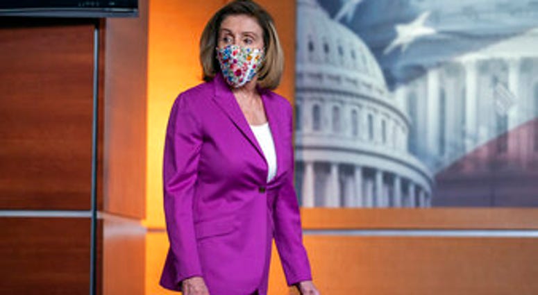 Speaker of the House Nancy Pelosi, D-Calif., holds a news conference on the day after violent protesters loyal to President Donald Trump stormed the U.S. Congress, at the Capitol in Washington, Thursday, Jan. 7, 2021. (AP Photo/J. Scott Applewhite) Speaker of the House Nancy Pelosi, D-Calif., holds a news conference on the day after violent protesters loyal to President Donald Trump stormed the U.S. Congress, at the Capitol in Washington, Thursday, Jan. 7, 2021. (AP Photo/J. Scott Applewhite)