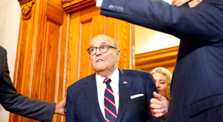 Rudy Giuliani walks to a senate hearing at the Georgia State Capitol in Atlanta on Thursday, December 3, 2020. (Rebecca Wright/Atlanta Journal-Constitution via AP) Rudy Giuliani walks to a senate hearing at the Georgia State Capitol in Atlanta on Thursday, December 3, 2020. (Rebecca Wright/Atlanta Journal-Constitution via AP)