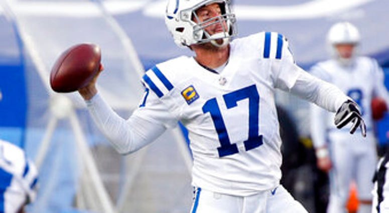 Indianapolis Colts' Philip Rivers (17) throws a pass to Jack Doyle for a touchdown during the second half of an NFL wild-card playoff football game against the Buffalo Bills Saturday, Jan. 9, 2021, in Orchard Park, N.Y. (AP Photo/Jeffrey T. Barnes) Indianapolis Colts' Philip Rivers (17) throws a pass to Jack Doyle for a touchdown during the second half of an NFL wild-card playoff football game against the Buffalo Bills Saturday, Jan. 9, 2021, in Orchard Park, N.Y. (AP Photo/Jeffrey T. Barnes)