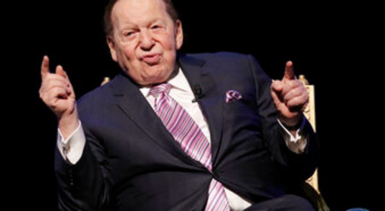 FILE - In this Sept. 13, 2016 file photo, U.S. billionaire Sheldon Adelson speaks during a news conference for the opening of Parisian Macao in Macau. (AP Photo/Kin Cheung, File) FILE - In this Sept. 13, 2016 file photo, U.S. billionaire Sheldon Adelson speaks during a news conference for the opening of Parisian Macao in Macau. (AP Photo/Kin Cheung, File)