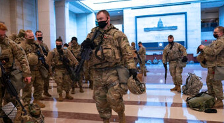 Hundreds of National Guard troops hold inside the Capitol Visitor's Center to reinforce security at the Capitol in Washington, Wednesday, Jan. 13, 2021. (AP Photo/J. Scott Applewhite) Hundreds of National Guard troops hold inside the Capitol Visitor's Center to reinforce security at the Capitol in Washington, Wednesday, Jan. 13, 2021. (AP Photo/J. Scott Applewhite)
