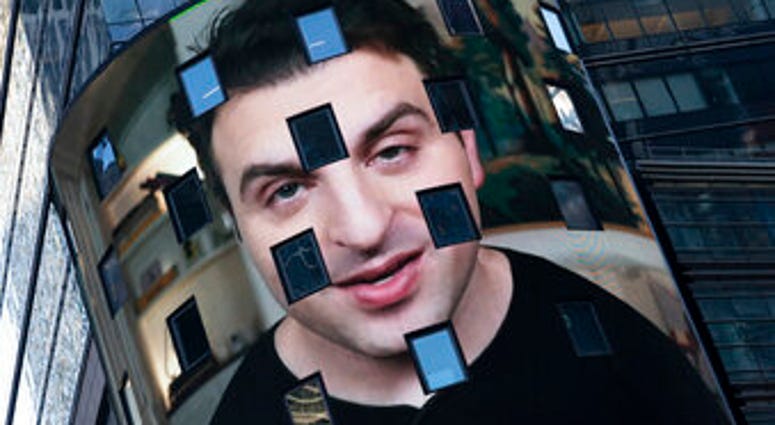 FILE - In this Dec. 10, 2020 file photo, Brian Chesky, CEO of Airbnb, is shown on an electronic screen at the Nasdaq MarketSite in New York. (AP Photo/Mark Lennihan) FILE - In this Dec. 10, 2020 file photo, Brian Chesky, CEO of Airbnb, is shown on an electronic screen at the Nasdaq MarketSite in New York. (AP Photo/Mark Lennihan)