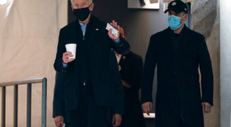 President-elect Joe Biden waves to reporters as walks out of The Queen theater Monday, Jan. 18, 2021, in Wilmington, Del. (AP Photo/Evan Vucci) President-elect Joe Biden waves to reporters as walks out of The Queen theater Monday, Jan. 18, 2021, in Wilmington, Del. (AP Photo/Evan Vucci)